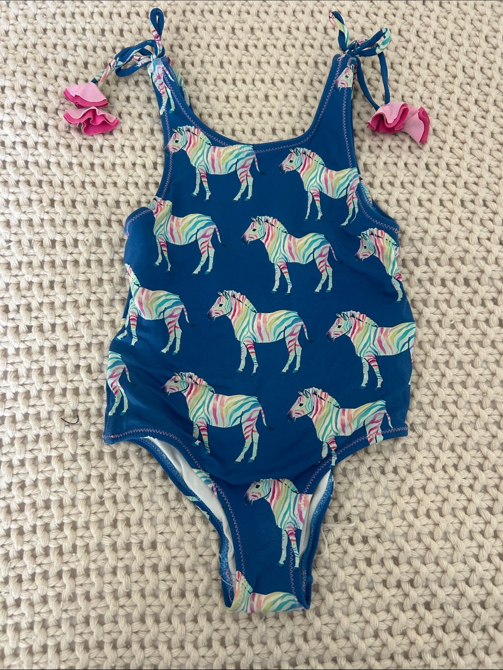 Hatley Navy One-Piece Swimsuit with Rainbow Zebra Print and Pink Tie Accents